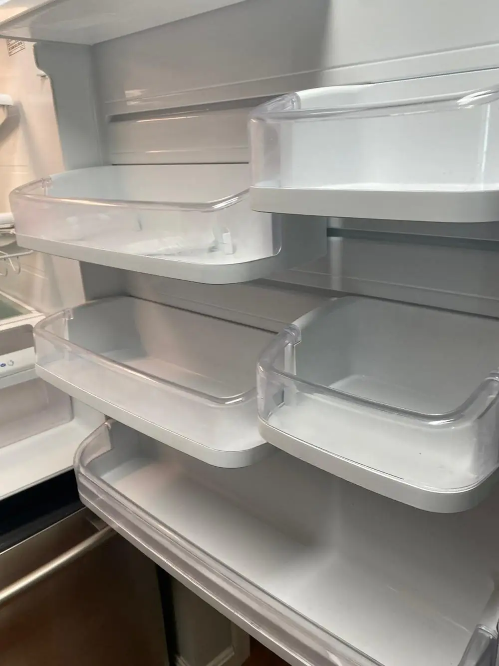 Clean refrigerator door shelves