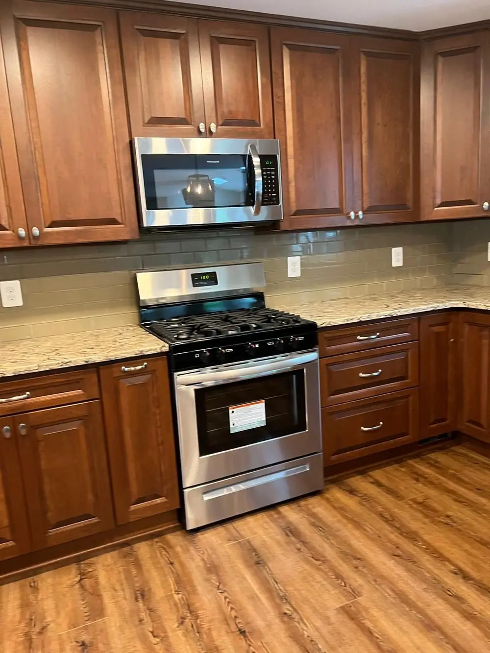 Kitchen with wood cabinets, cleaned